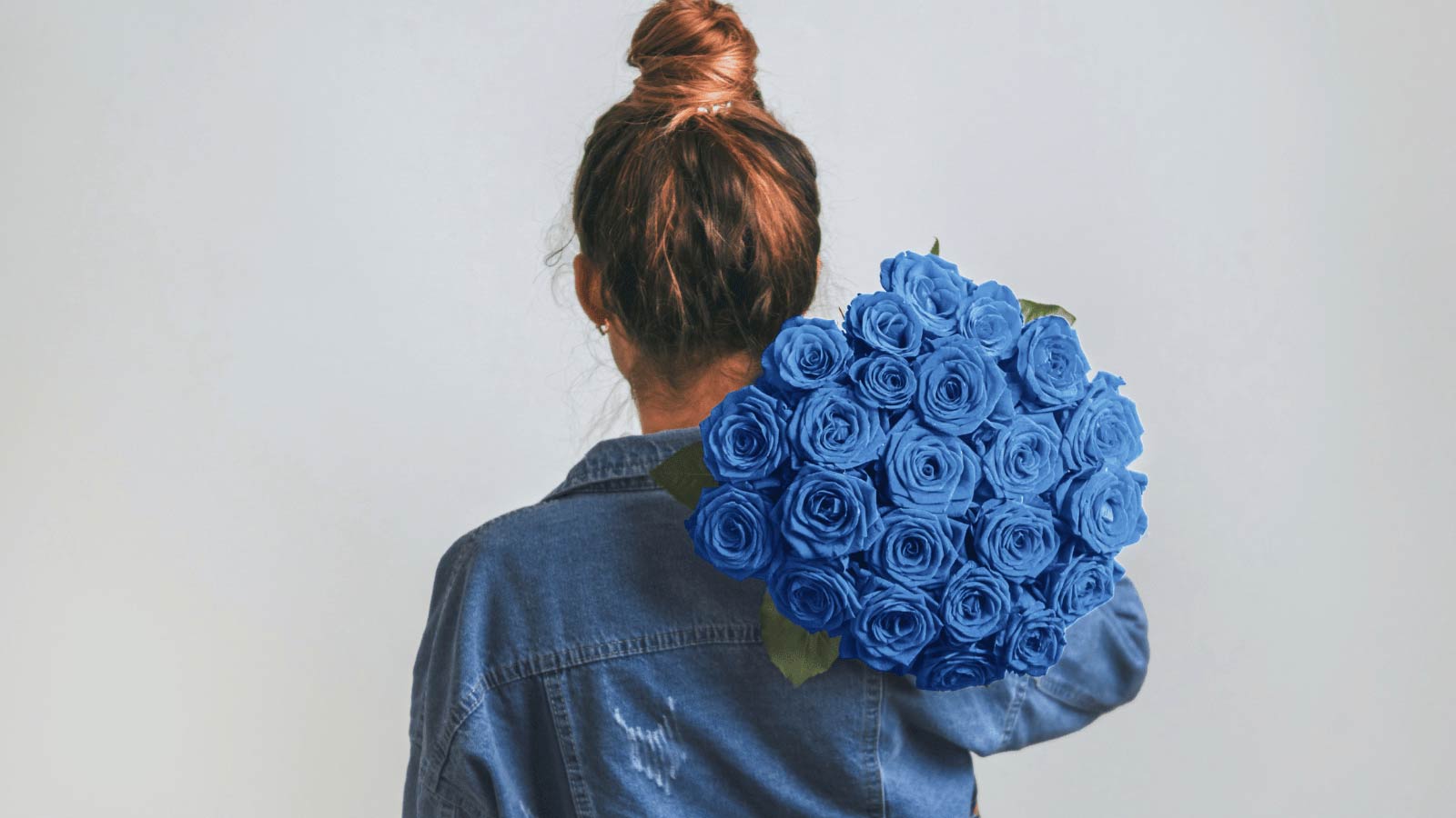 woman with blue roses wondering what they mean