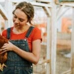 woman giving chicken care tips