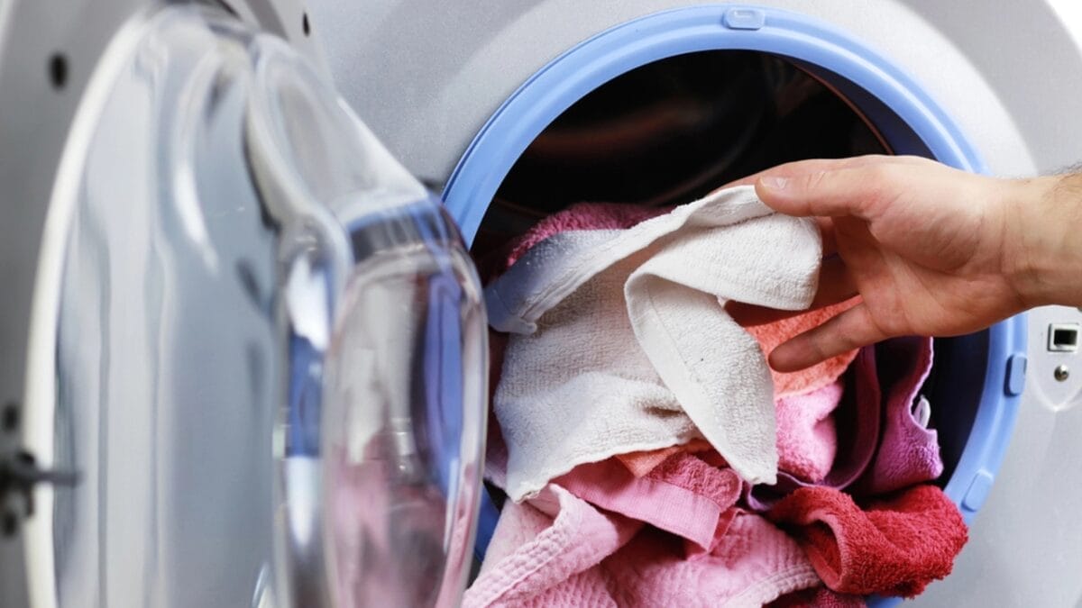 15 Ways Apple Cider Vinegar Can Banish Dirt, Grime & Odors in Your Home - laundry in washing machine dp127903584